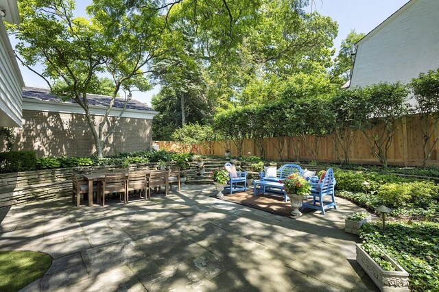 100 Beach Rd, Glencoe, IL 60022 - fenced backyard with a patio and outdoor dining space