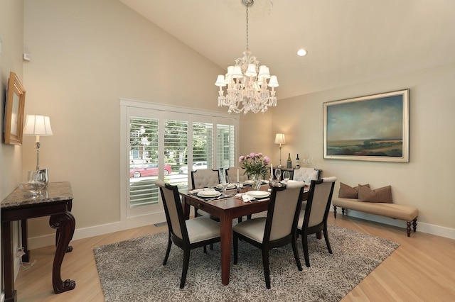 100 Beach Rd, Glencoe, IL 60022 - dining space with a chandelier, high vaulted ceiling, light wood-style floors, and recessed lighting