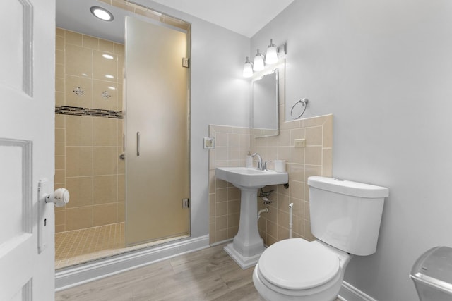 317 N Marion St, Oak Park, IL 60302 - bathroom featuring a stall shower, tile walls, and wood finished floors