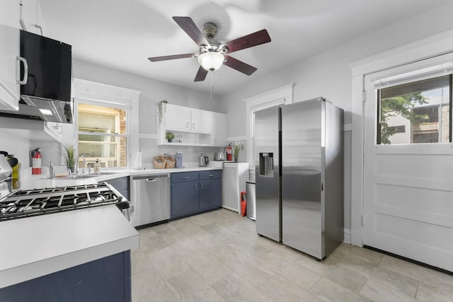 317 N Marion St, Oak Park, IL 60302 - kitchen with appliances with stainless steel finishes, a ceiling fan, light countertops, open shelves, and blue cabinetry
