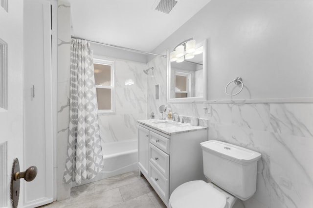317 N Marion St, Oak Park, IL 60302 - bathroom featuring shower / tub combo with curtain, vanity, and tile walls