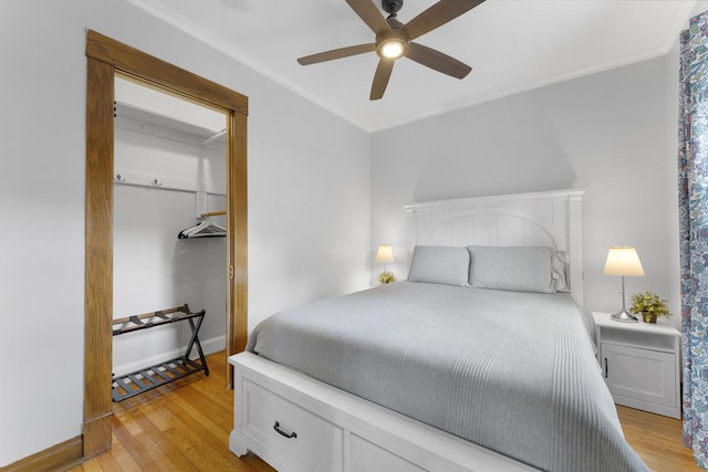 317 N Marion St, Oak Park, IL 60302 - bedroom with light wood-type flooring, crown molding, and a ceiling fan