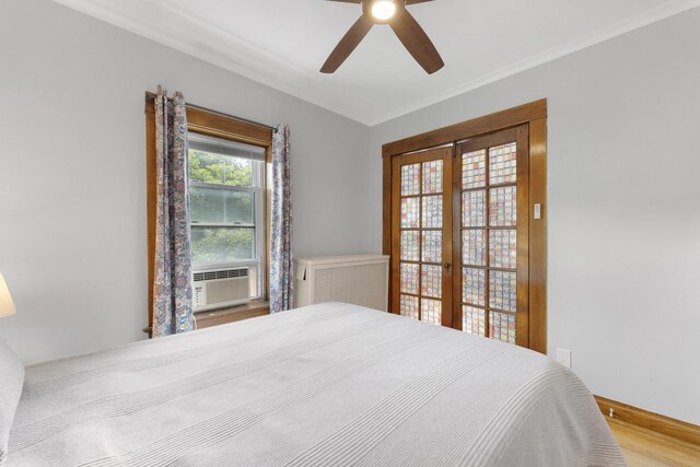 317 N Marion St, Oak Park, IL 60302 - bedroom featuring french doors, wood finished floors, cooling unit, and a ceiling fan