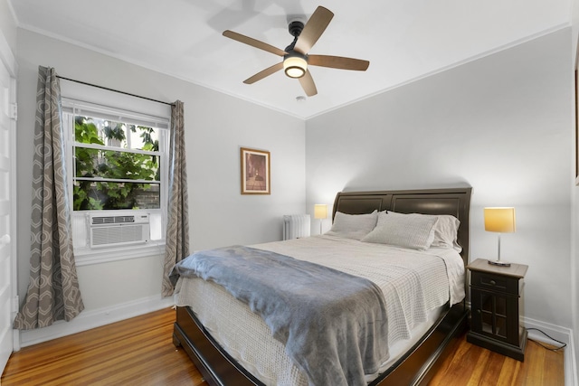 317 N Marion St, Oak Park, IL 60302 - bedroom with radiator heating unit, wood finished floors, cooling unit, crown molding, and a ceiling fan