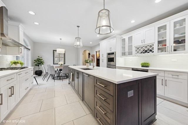 3967 Garden Ave, Western Springs, IL 60558 - kitchen with wall chimney exhaust hood, white cabinetry, backsplash, recessed lighting, and light countertops