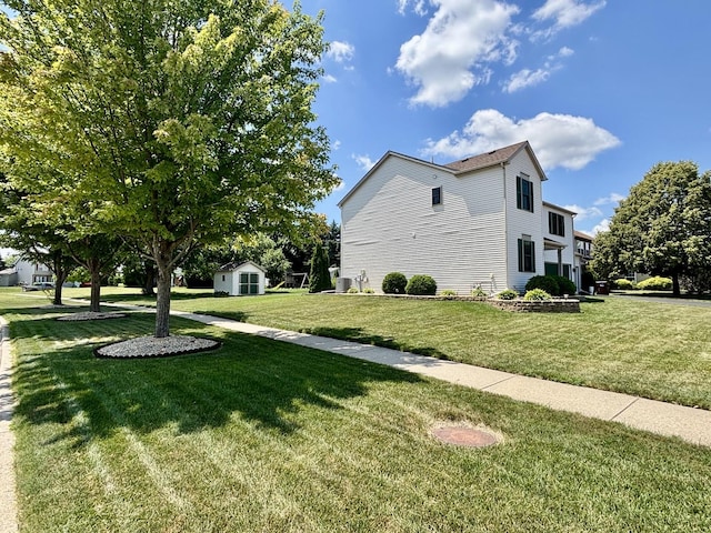 2525 E 6th St, Belvidere, IL 61008 - view of property exterior featuring a shed and a lawn