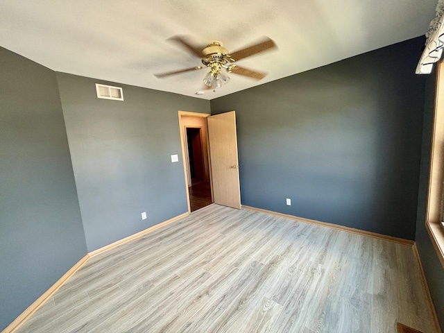 2525 E 6th St, Belvidere, IL 61008 - spare room featuring wood finished floors and a ceiling fan