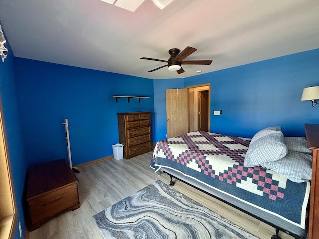 2525 E 6th St, Belvidere, IL 61008 - bedroom with wood finished floors, ceiling fan, and a closet