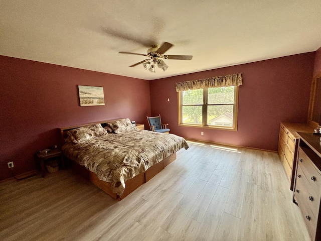 2525 E 6th St, Belvidere, IL 61008 - bedroom featuring light wood finished floors and ceiling fan