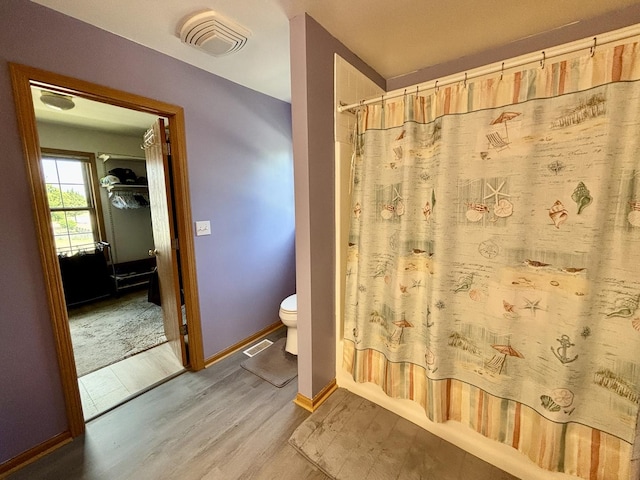 2525 E 6th St, Belvidere, IL 61008 - full bathroom with wood finished floors and toilet