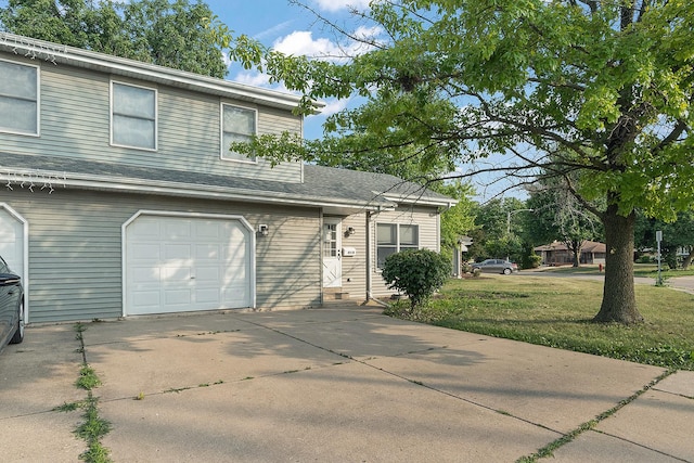 831 Horseshoe Dr Unit B, Joliet, IL 60435 - view of front of house with a garage, concrete driveway, and a front lawn
