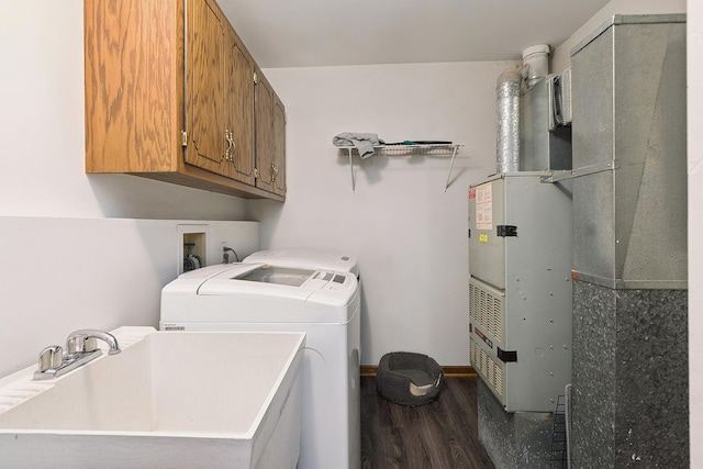 831 Horseshoe Dr Unit B, Joliet, IL 60435 - washroom with dark wood-style flooring, cabinet space, washing machine and dryer, and heating unit
