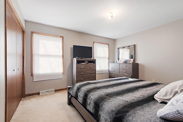 831 Horseshoe Dr Unit B, Joliet, IL 60435 - bedroom featuring light carpet and a closet