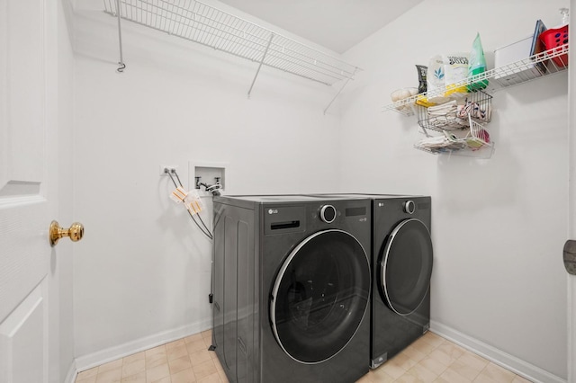 2311 Tremont Ave, Aurora, IL 60502 - washroom featuring separate washer and dryer and baseboards