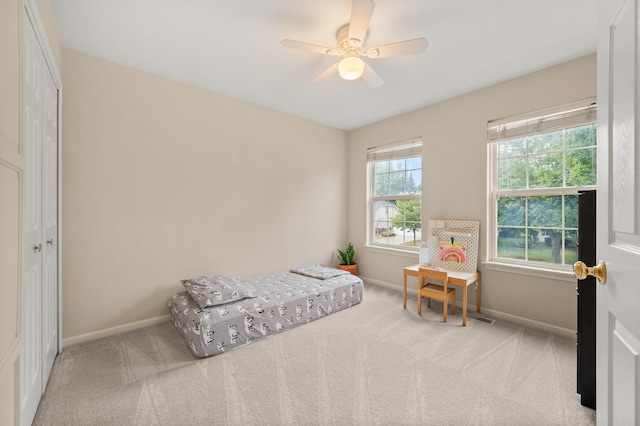 2311 Tremont Ave, Aurora, IL 60502 - carpeted bedroom with baseboards and ceiling fan