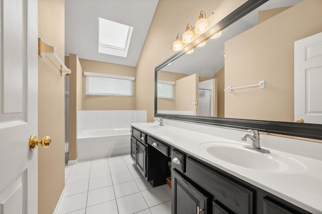 2311 Tremont Ave, Aurora, IL 60502 - bathroom with a skylight, tile patterned flooring, double vanity, a garden tub, and vaulted ceiling