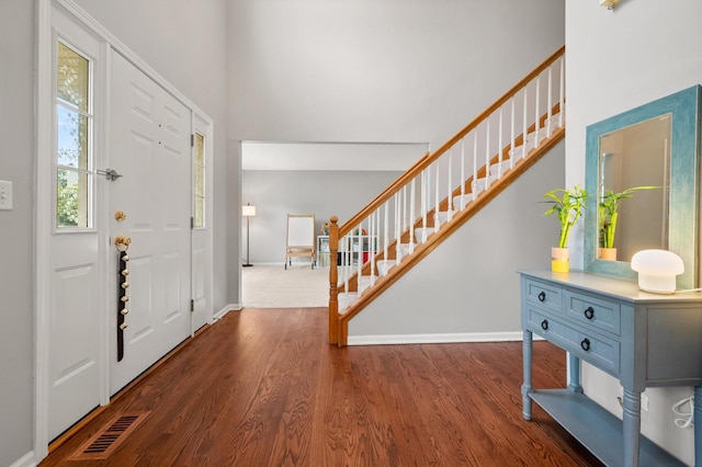 2311 Tremont Ave, Aurora, IL 60502 - foyer entrance with stairs, dark wood-type flooring, and a towering ceiling
