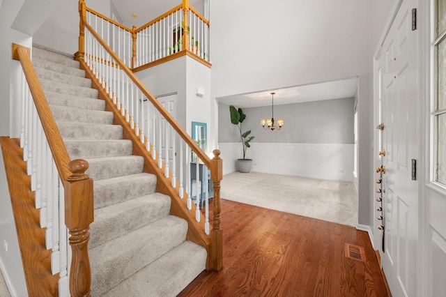 2311 Tremont Ave, Aurora, IL 60502 - foyer with stairway, wood finished floors, a chandelier, and a towering ceiling