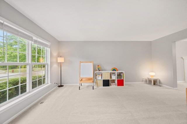 2311 Tremont Ave, Aurora, IL 60502 - recreation room featuring baseboards and light carpet