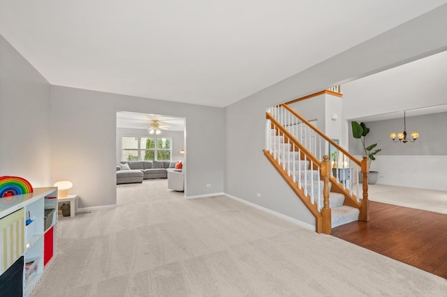 2311 Tremont Ave, Aurora, IL 60502 - rec room with carpet, a chandelier, and ceiling fan