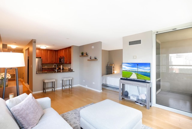 345 N La Salle Dr Unit 1010, Chicago, IL 60654 - living area with light wood-type flooring and baseboards