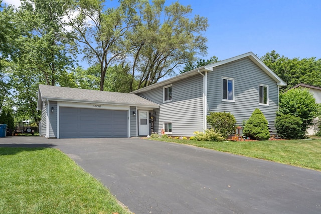 3850 Seaview Dr, Hanover Park, IL 60133 - tri-level home featuring asphalt driveway, a front yard, and an attached garage