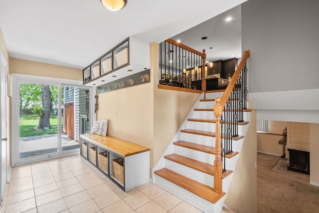3850 Seaview Dr, Hanover Park, IL 60133 - stairway with tile patterned flooring, recessed lighting, and a fireplace