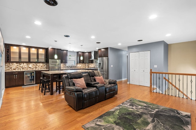 3850 Seaview Dr, Hanover Park, IL 60133 - living room featuring wine cooler, light wood-style floors, recessed lighting, and bar
