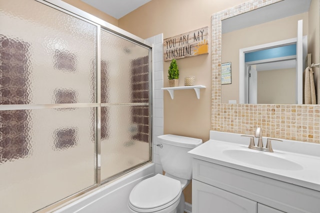 3850 Seaview Dr, Hanover Park, IL 60133 - bathroom featuring tasteful backsplash, vanity, and shower / bath combination with glass door