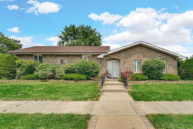 324 E 173rd Pl, South Holland, IL 60473 - view of front facade with brick siding and a front yard
