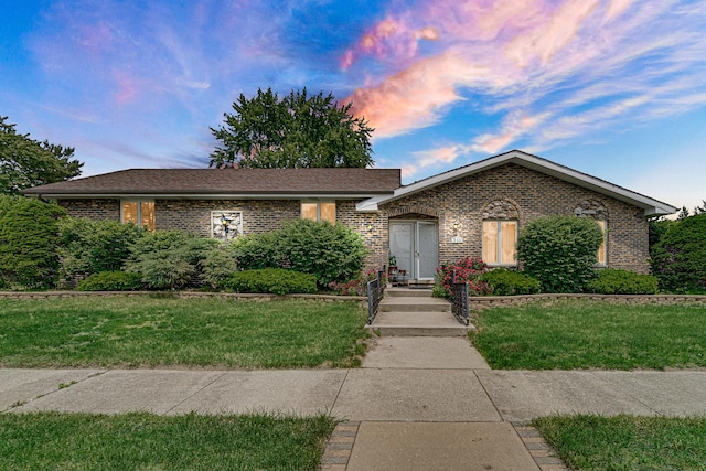 324 E 173rd Pl, South Holland, IL 60473 - ranch-style house featuring brick siding and a lawn