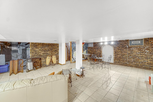 324 E 173rd Pl, South Holland, IL 60473 - unfurnished living room featuring brick wall and tile patterned flooring