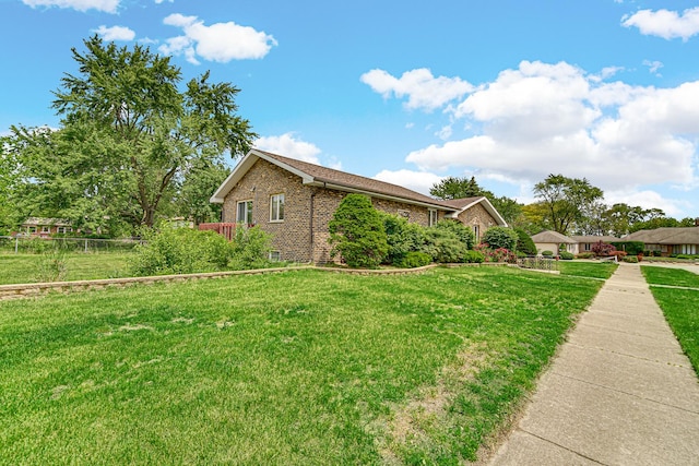 324 E 173rd Pl, South Holland, IL 60473 - view of side of home featuring brick siding and a yard