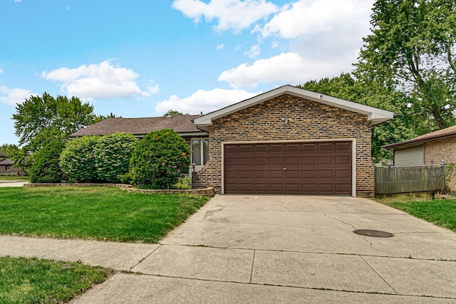 324 E 173rd Pl, South Holland, IL 60473 - view of front of house with brick siding, a garage, and concrete driveway