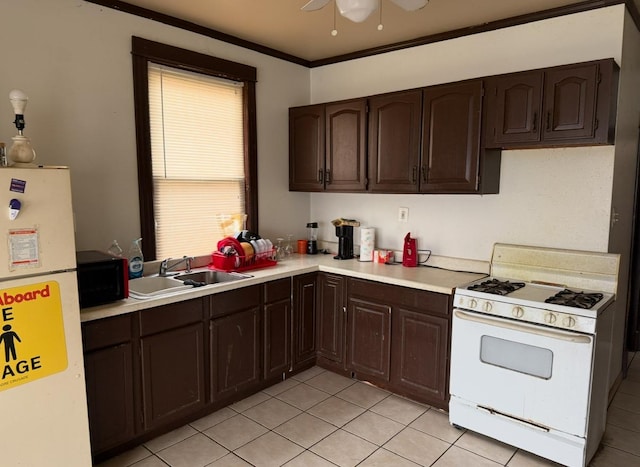 7232 S Aberdeen St, Chicago, IL 60621 - kitchen featuring white appliances, light countertops, dark brown cabinets, light tile patterned flooring, and a ceiling fan