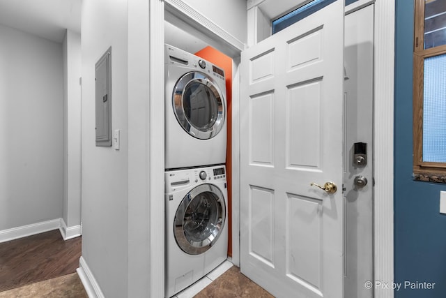 5323 S Harper Ave S Unit 1, Chicago, IL 60615 - laundry area with stacked washing machine and dryer, electric panel, and wood finished floors