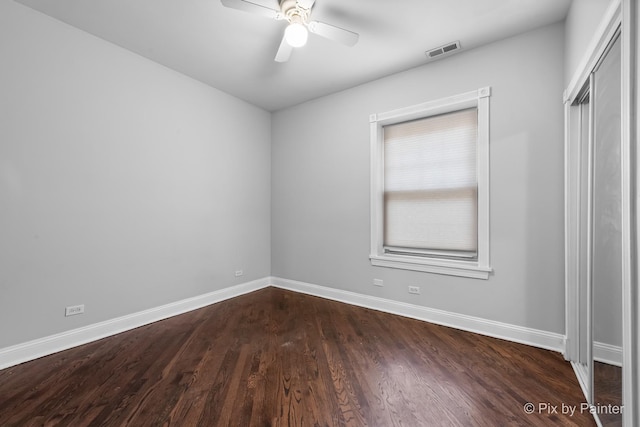 5323 S Harper Ave S Unit 1, Chicago, IL 60615 - spare room with dark wood-style flooring and a ceiling fan