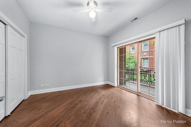 5323 S Harper Ave S Unit 1, Chicago, IL 60615 - unfurnished bedroom featuring access to exterior, wood finished floors, a closet, and a ceiling fan