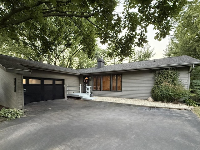 6412 Redbird Ln, Crystal Lake, IL 60012 - view of front of home featuring a chimney, driveway, and an attached garage