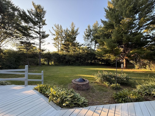 6412 Redbird Ln, Crystal Lake, IL 60012 - deck with an outdoor fire pit, a lawn, and view of wooded area