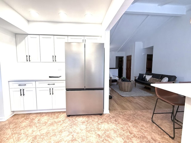 6412 Redbird Ln, Crystal Lake, IL 60012 - kitchen with freestanding refrigerator, white cabinets, and light wood-style floors