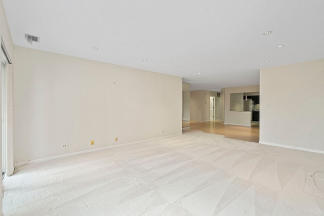 3100 Lexington Ln Unit 203, Glenview, IL 60026 - empty room featuring light colored carpet and recessed lighting