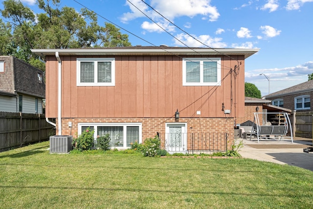 7726 S Moody Ave, Burbank, IL 60459 - rear view of property with brick siding and a patio area