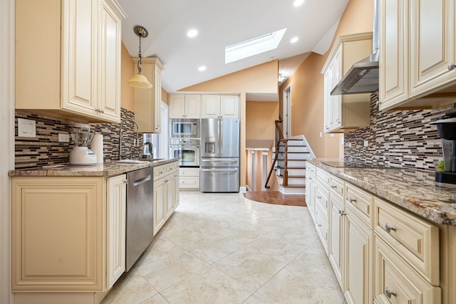 7726 S Moody Ave, Burbank, IL 60459 - kitchen featuring stainless steel appliances, a skylight, cream cabinets, vaulted ceiling, and tasteful backsplash