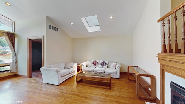 270 W Fremont Ave, Elmhurst, IL 60126 - living area featuring vaulted ceiling, a skylight, light wood-type flooring, and recessed lighting
