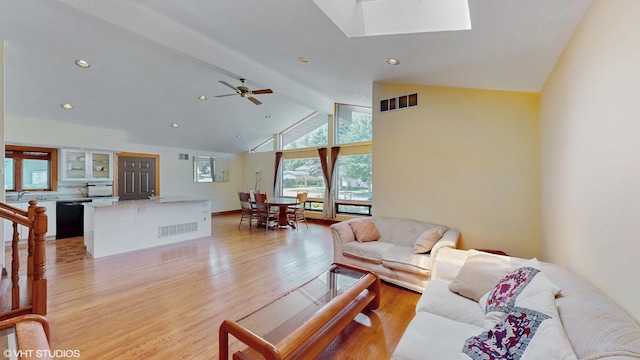 270 W Fremont Ave, Elmhurst, IL 60126 - living room with light wood finished floors, beamed ceiling, a skylight, recessed lighting, and high vaulted ceiling