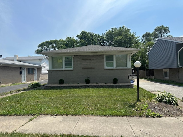 16341 Justine St, Markham, IL 60428 - view of front facade featuring brick siding and a front lawn