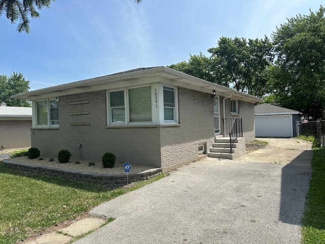 16341 Justine St, Markham, IL 60428 - ranch-style home featuring brick siding, an outdoor structure, and a garage