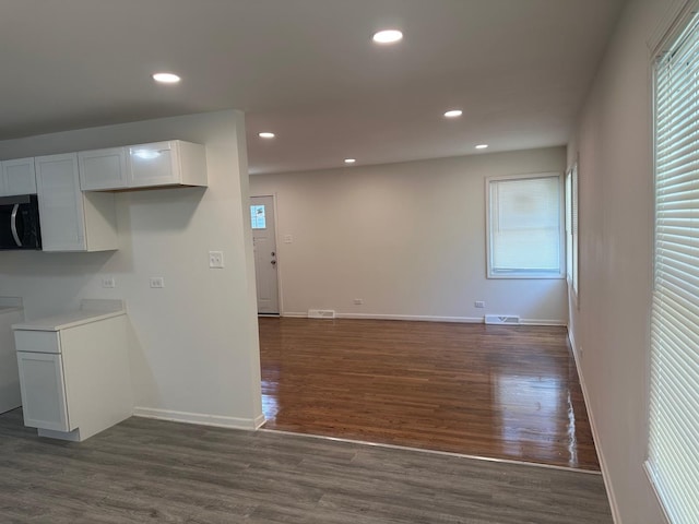 16341 Justine St, Markham, IL 60428 - kitchen featuring recessed lighting, dark wood-style floors, white cabinets, open floor plan, and light countertops