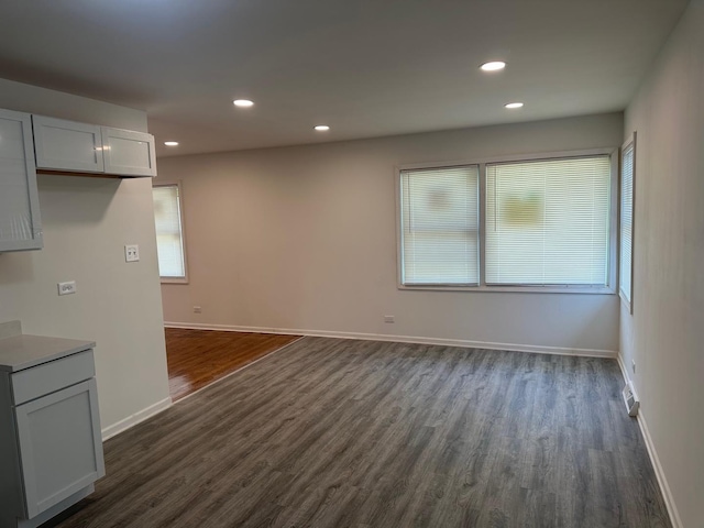 16341 Justine St, Markham, IL 60428 - unfurnished living room with dark wood-type flooring and recessed lighting